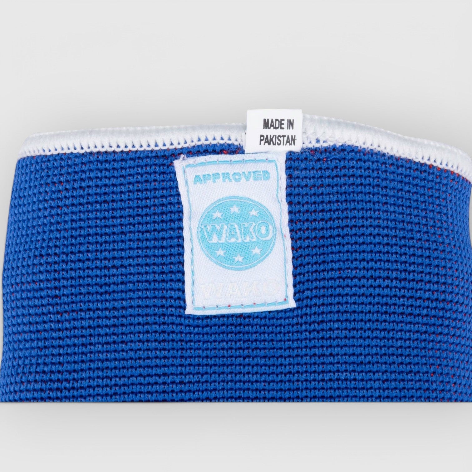 TOP TEN vendbar blå/rød WAKO - Godkjent Albuebeskytter m UV - LABEL - CombatStore.no